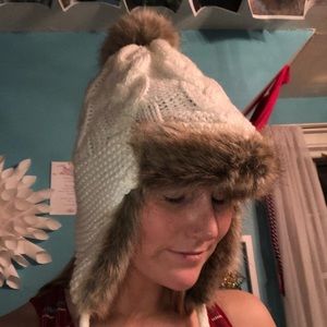 white eskimo hat with pom poms